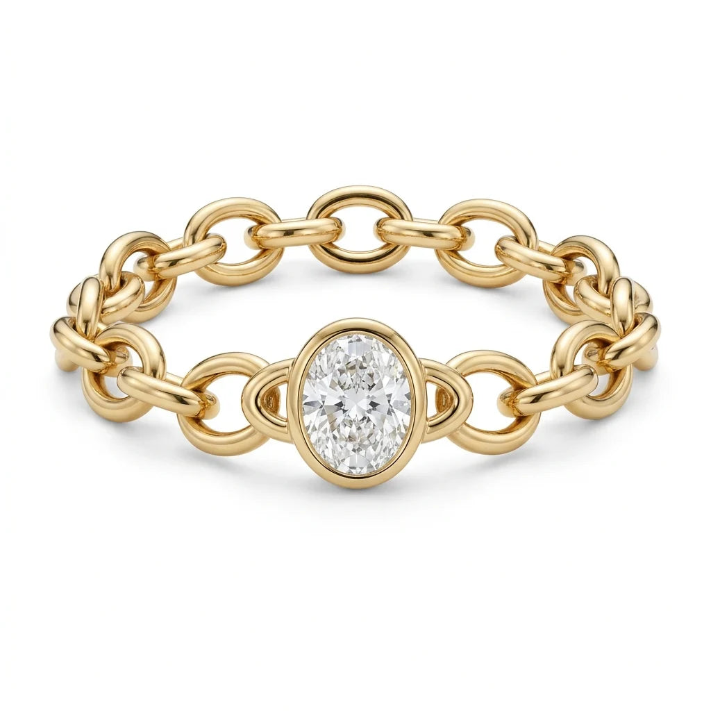 Sculpted 18k yellow gold link bracelet with a bezel-set oval diamond station on a white studio background